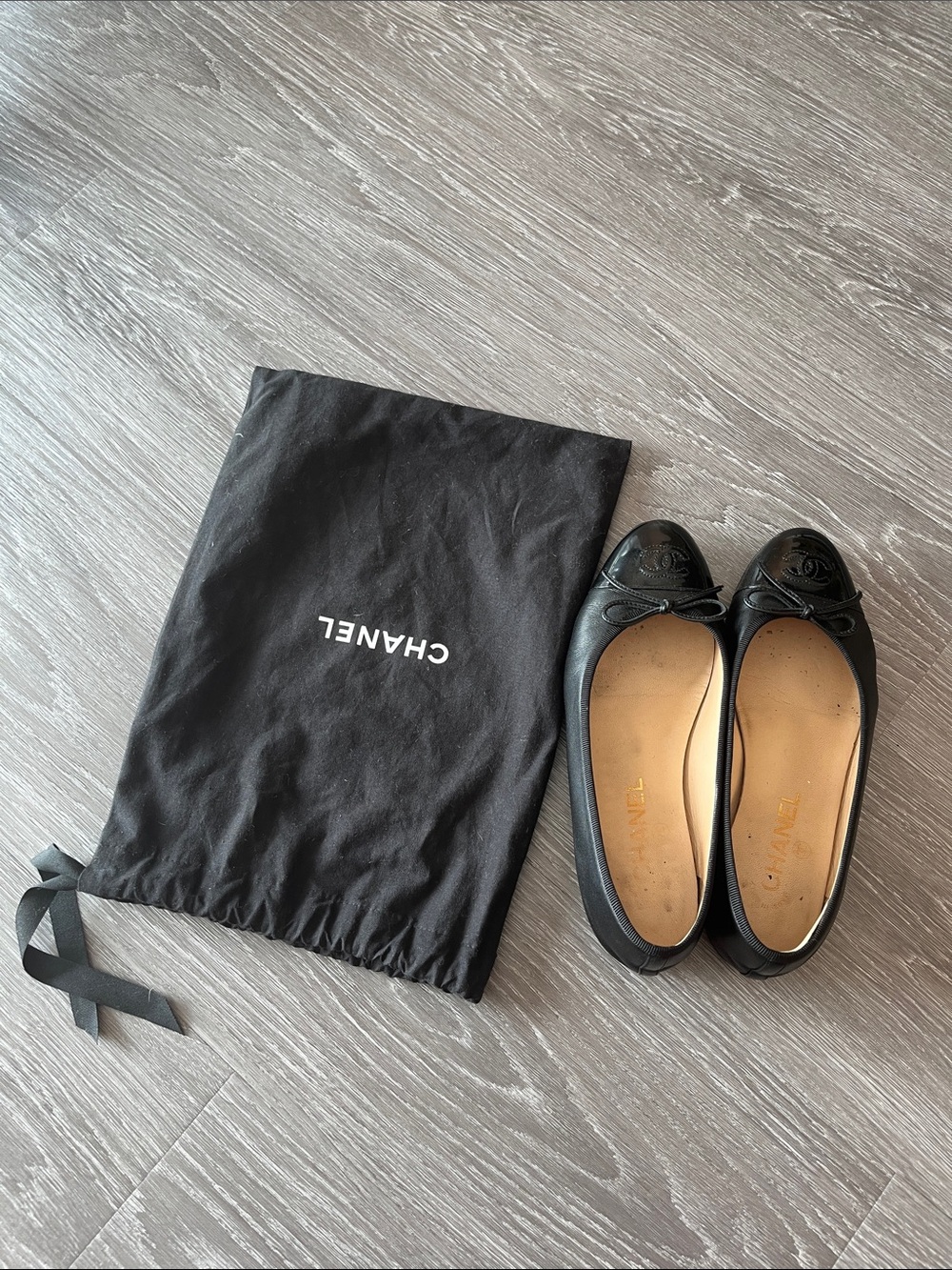 CHANEL Black Leather Cap-Toe Ballet Flats with CC Emblem